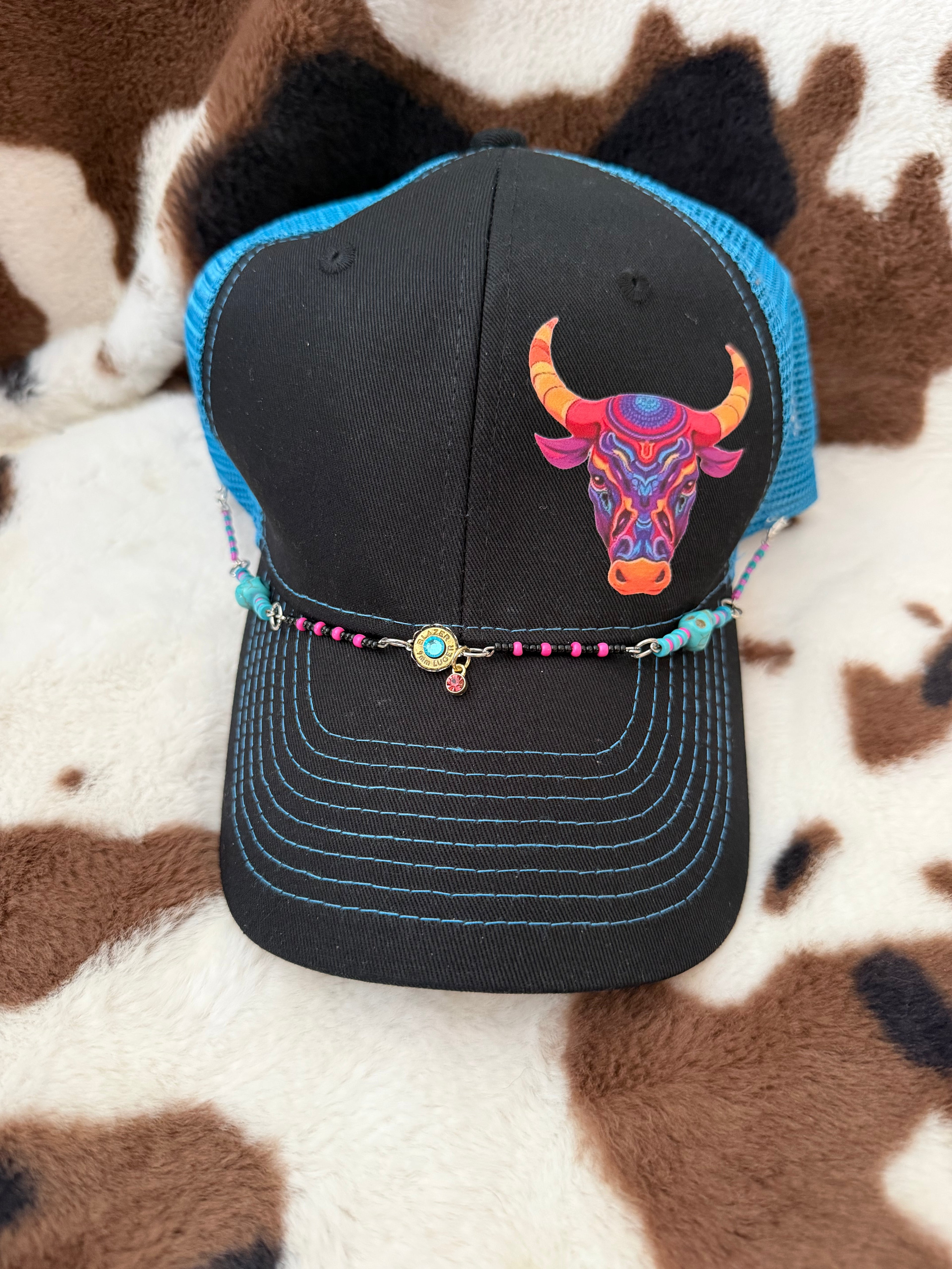 Turquoise blue and orange baseball cap
