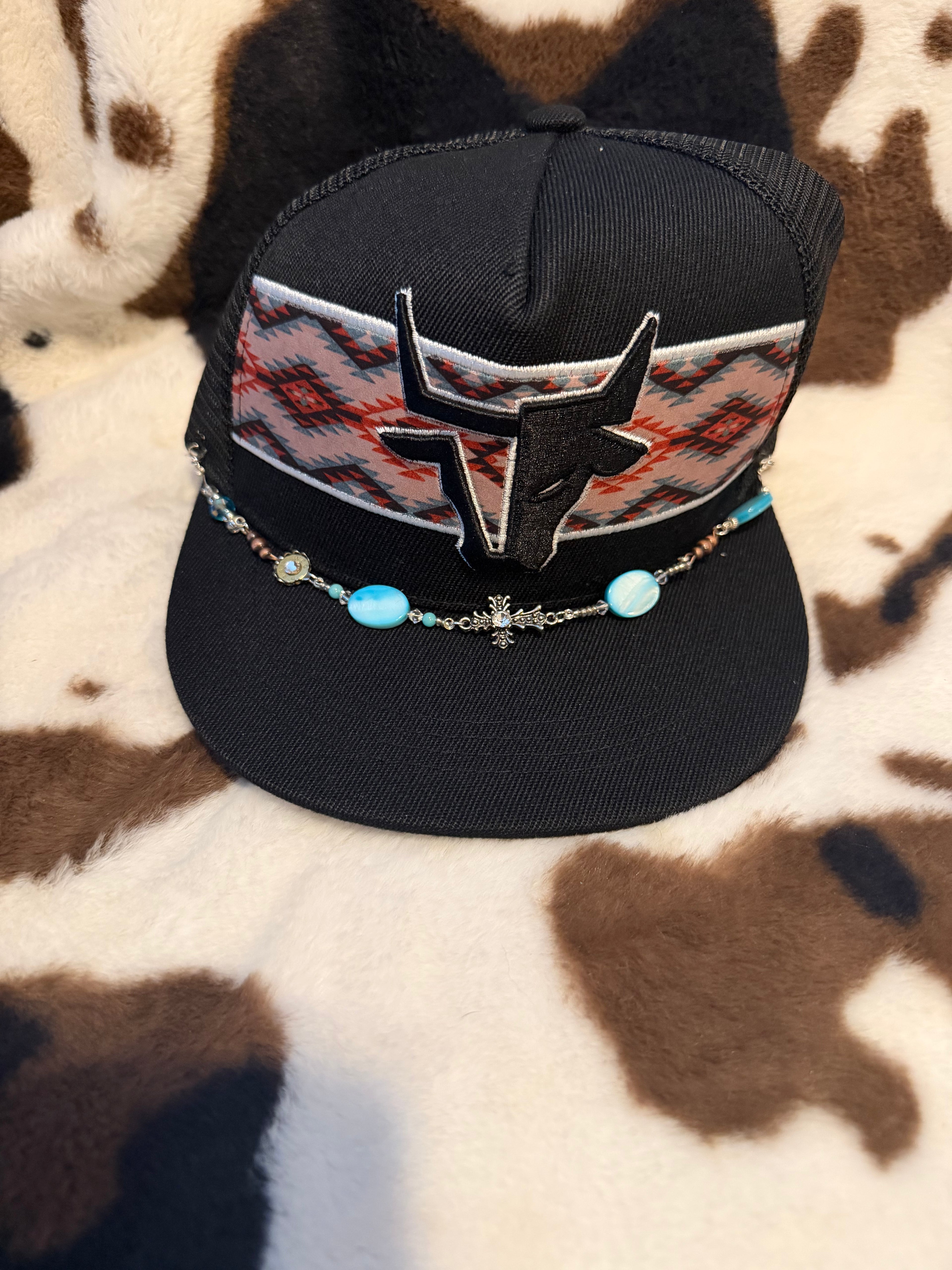 Bull head with Aztec baseball cap and cross hat chain