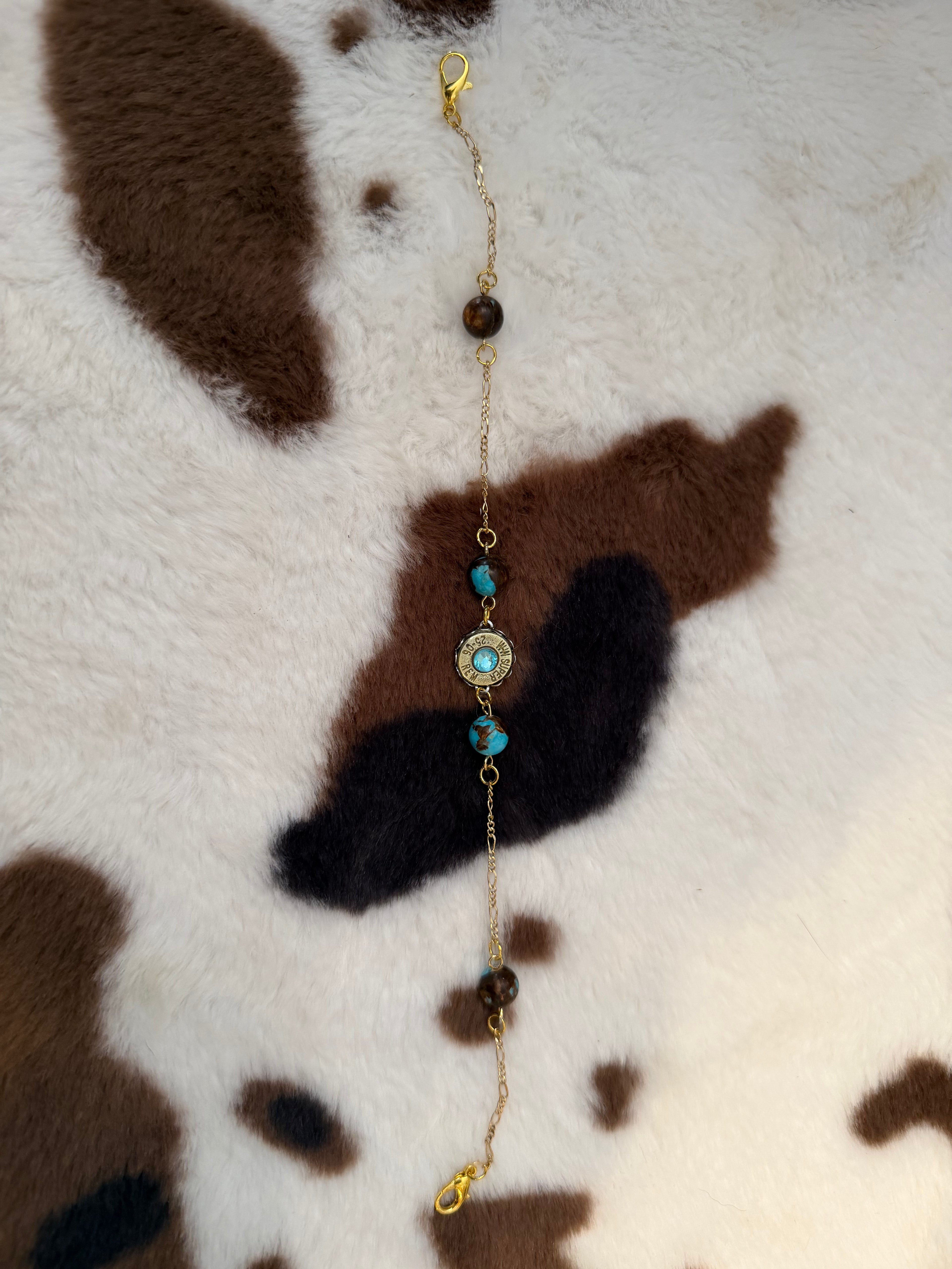 Gold hat, charm with turquoise and brown beads